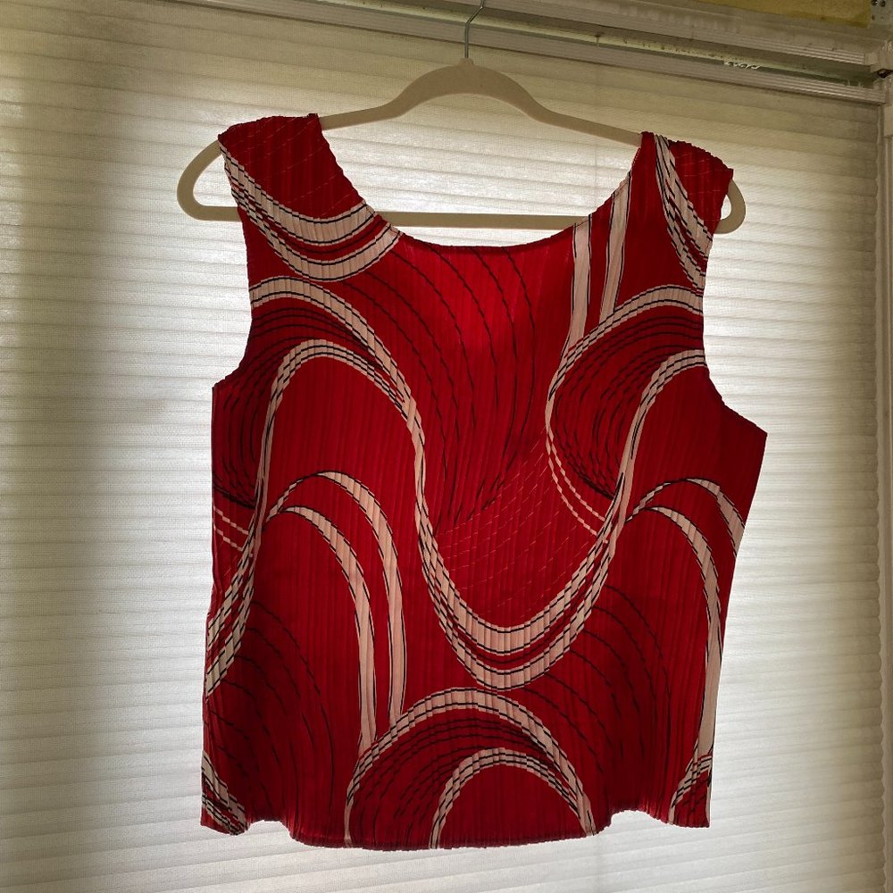 Vivid red pleated blouse with white/black designs
